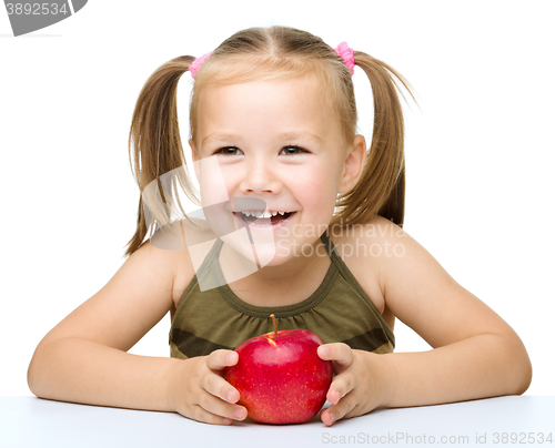 Image of Little girl with red apple