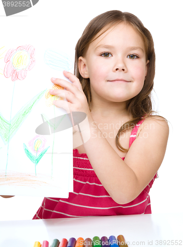 Image of Little girl is showing her drawing