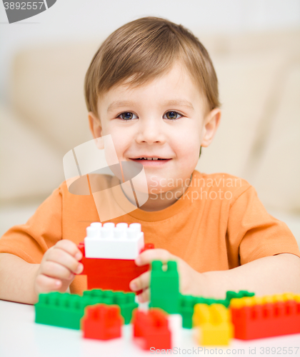 Image of Boy is playing with building blocks