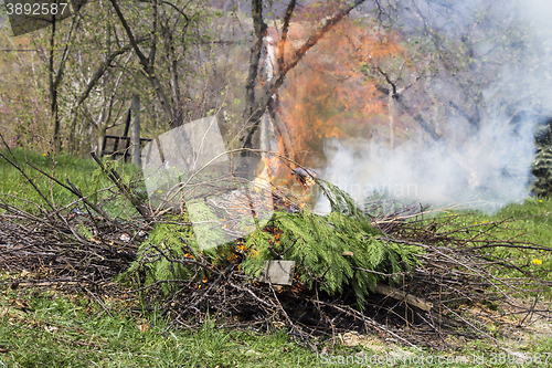 Image of Fire and Smoke from during Burning branches