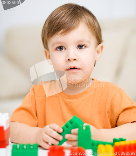 Image of Boy is playing with building blocks