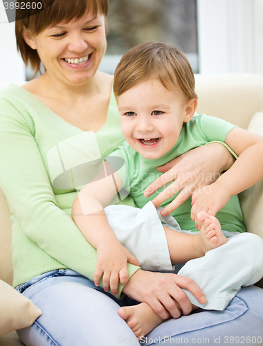 Image of Mother is having fun with her son
