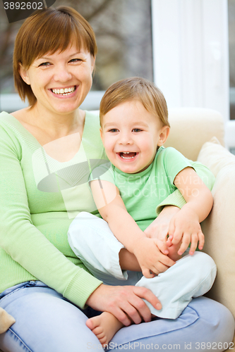 Image of Mother is having fun with her son