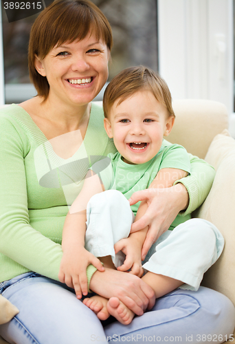 Image of Mother is having fun with her son