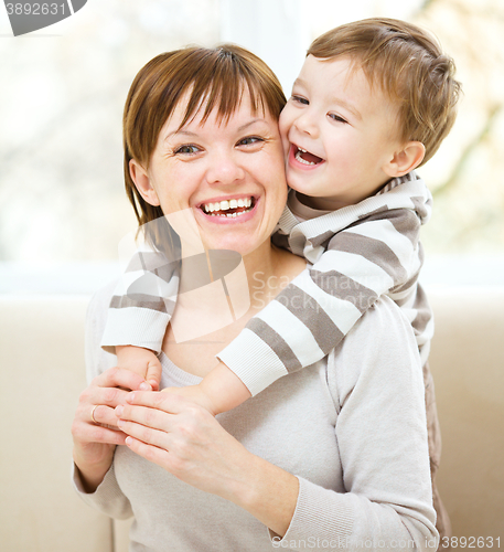 Image of Mother is having fun with her son