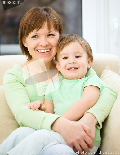 Image of Mother is having fun with her son