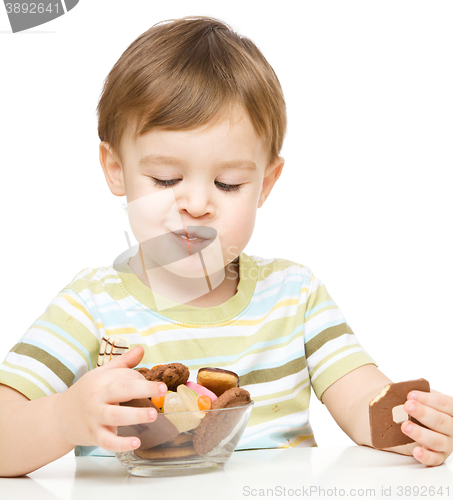 Image of Portrait of a boy with cookies