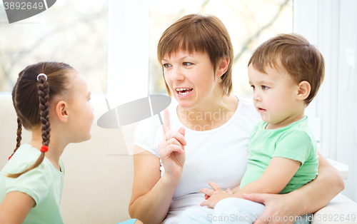 Image of Mother talking to her children