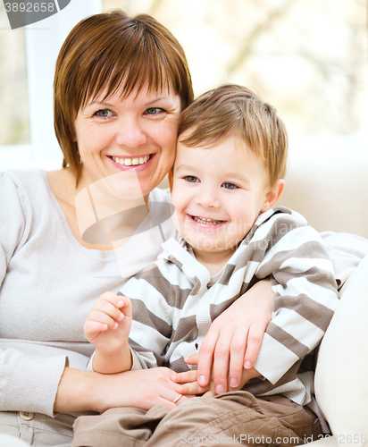 Image of Mother is having fun with her son