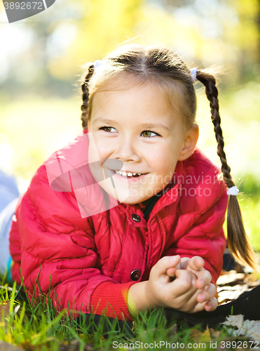 Image of Portrait of a little girl in autumn park