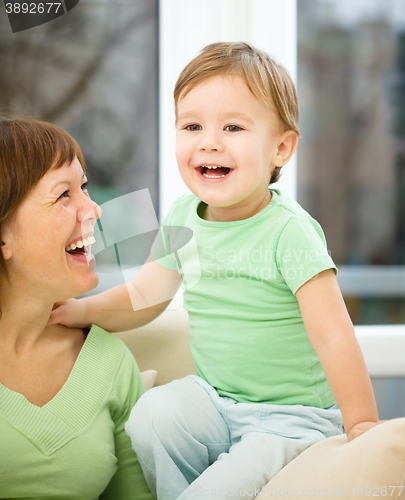 Image of Mother is having fun with her son