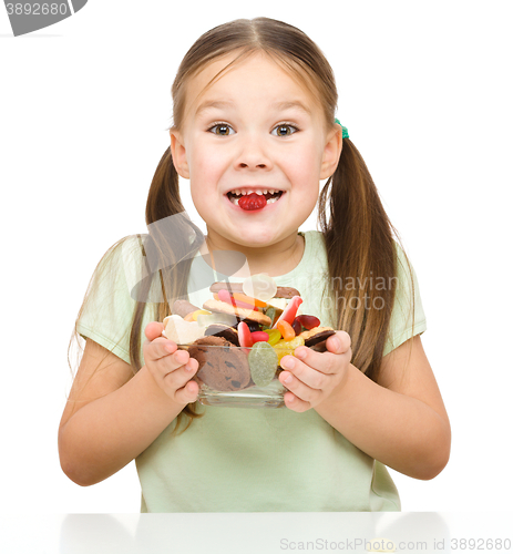 Image of Happy girl with candies