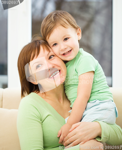 Image of Mother is having fun with her son