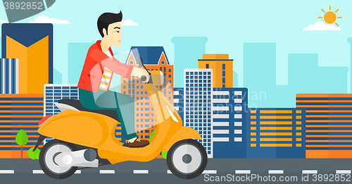 Image of Man riding scooter.