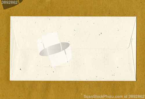 Image of Letter envelope over paper background