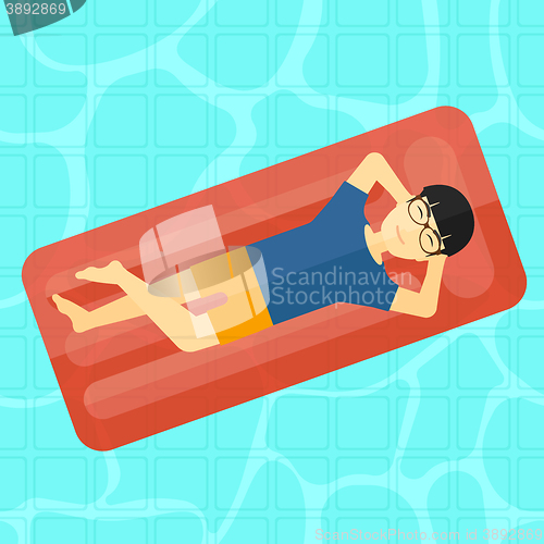 Image of Man relaxing in swimming pool.