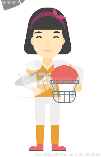 Image of Rugby player with ball and helmet in hands.