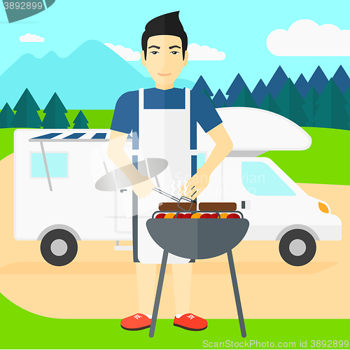 Image of Man preparing barbecue.