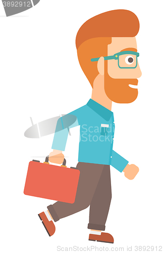 Image of Businessman walking with briefcase.