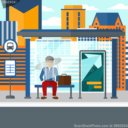 Image of Man waiting for bus.