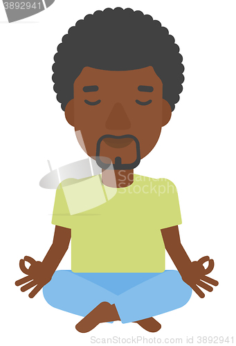 Image of Man meditating in lotus pose.