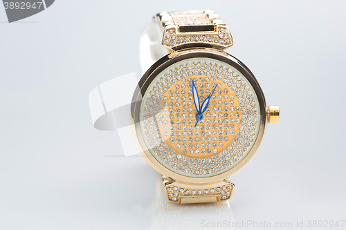 Image of gold watch with diamonds