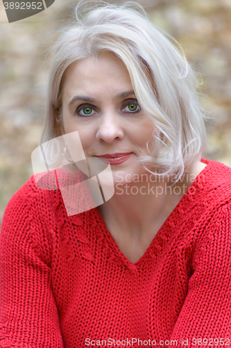 Image of Blonde in a red pullover