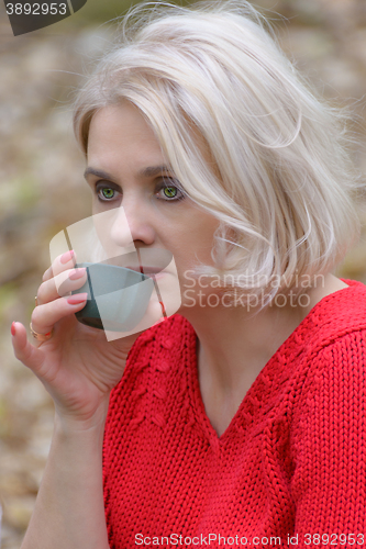 Image of Blonde in a red pullover