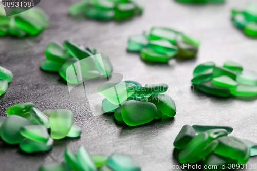 Image of green pieces of glass polished by the sea