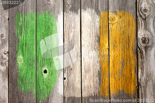 Image of irish colors on old wooden wound