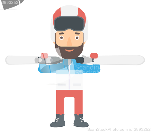 Image of Man holding skis.