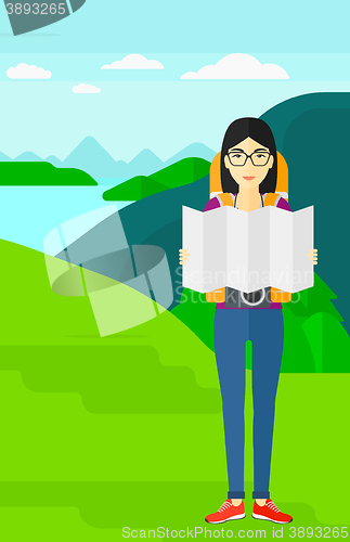 Image of Backpacker looking at map.
