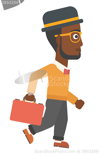 Image of Businessman walking with briefcase.