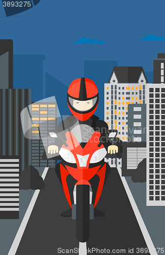 Image of Man riding motorcycle.