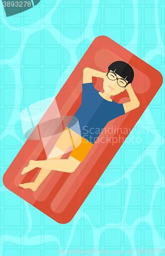 Image of Man relaxing in swimming pool.