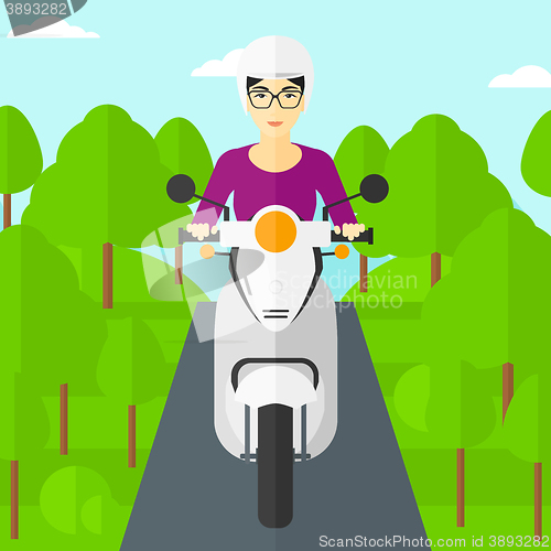 Image of Woman riding scooter.