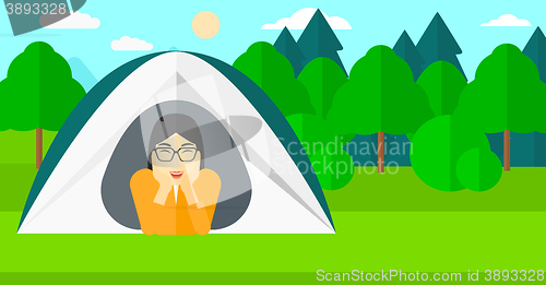 Image of Woman lying in tent.