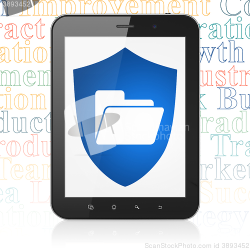 Image of Finance concept: Tablet Computer with Folder With Shield on display