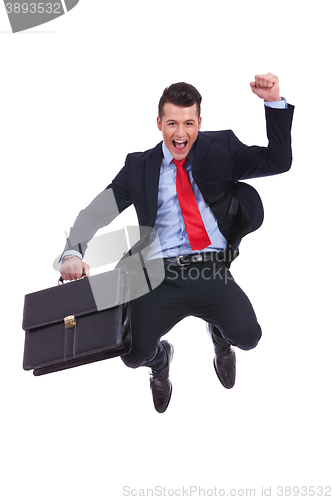 Image of very happy young business man jumping