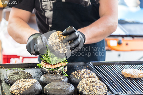 Image of Beef burgers ready to serve on food stall.