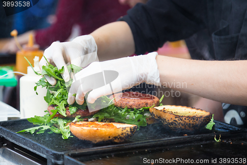 Image of Beef burgers ready to serve on food stall.