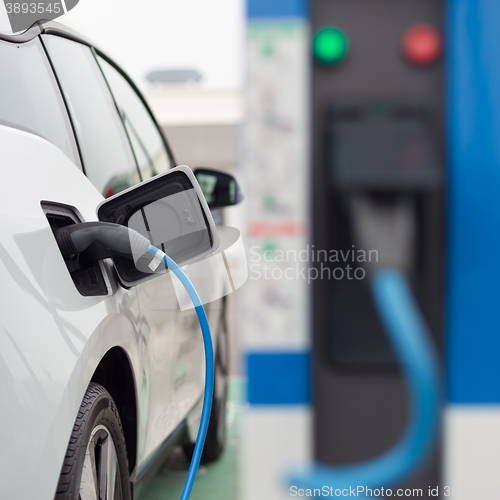 Image of Electric Car in Charging Station.