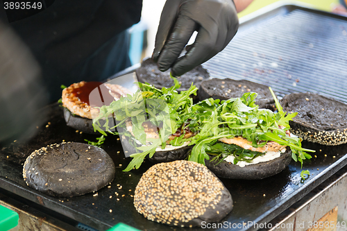 Image of Beef burgers ready to serve on food stall.