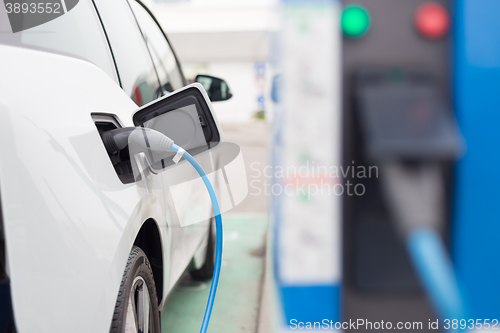 Image of Electric Car in Charging Station.