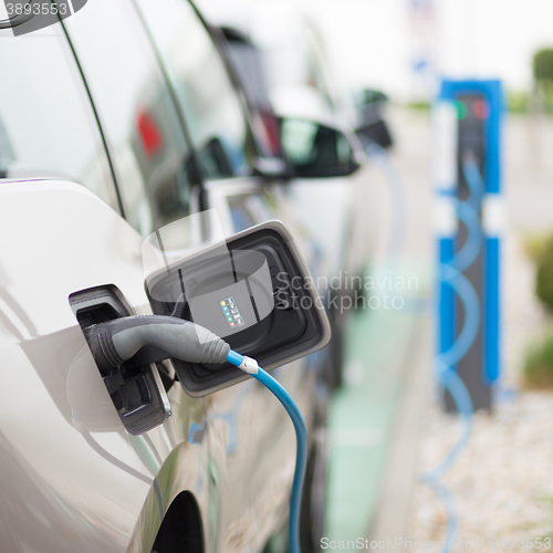 Image of Electric Car in Charging Station.