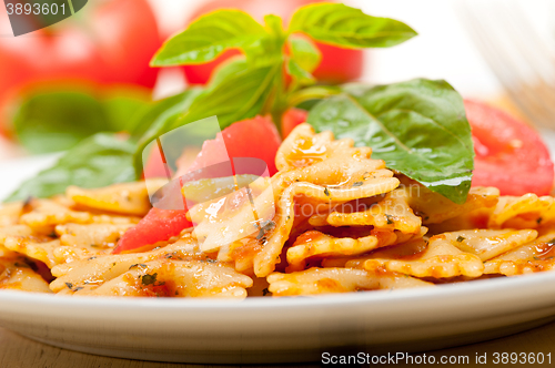 Image of Italian pasta farfalle butterfly bow-tie and tomato sauce