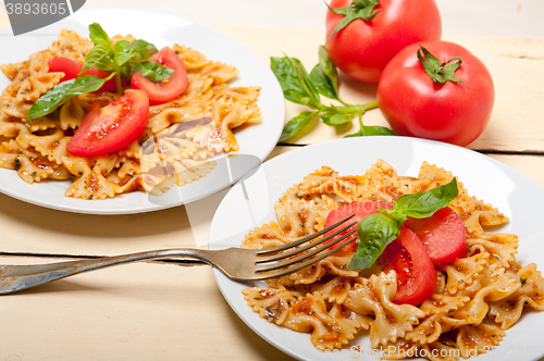 Image of Italian pasta farfalle butterfly bow-tie and tomato sauce