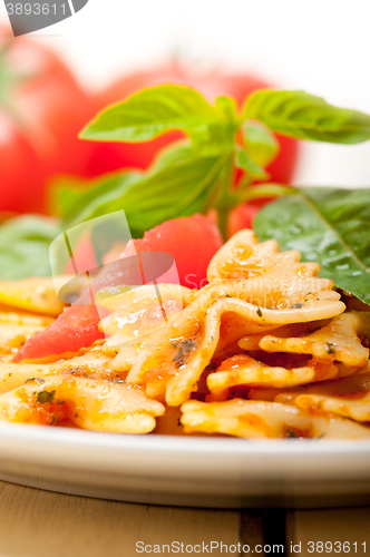 Image of Italian pasta farfalle butterfly bow-tie and tomato sauce
