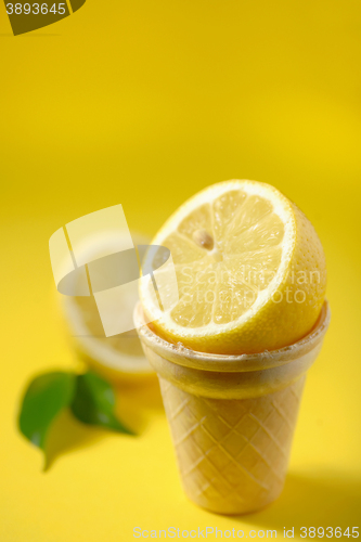 Image of Cut lemon fruit in ice cream cone