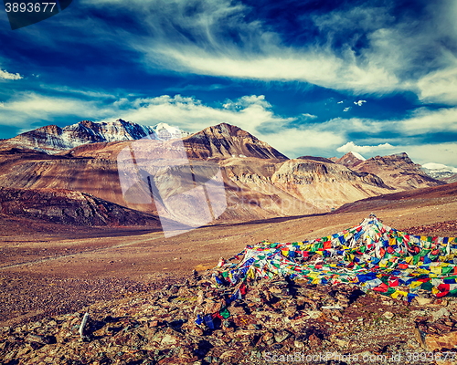 Image of Buddhist prayer flags lungta at mountain pass in Himalayas